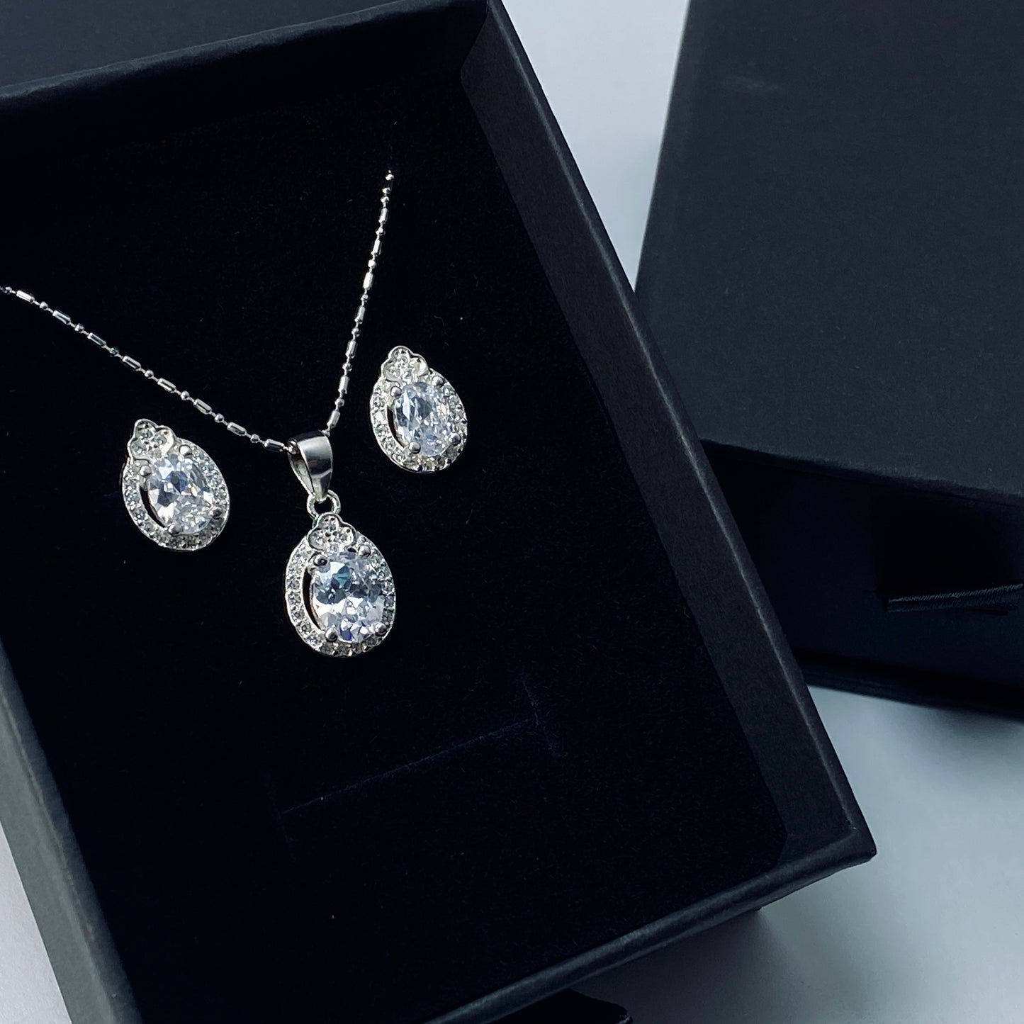 Sparkling Teardrop Halo Studs and Pendant Set